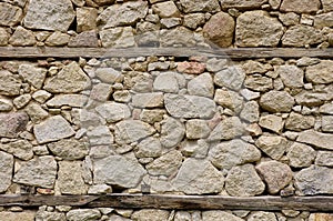 Old stone wall with wooden beams