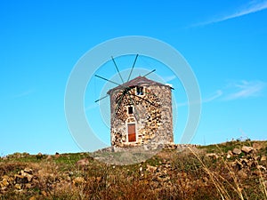 Old stone windmill in Cunda, Alibey island, AyvalÄ±k BalÄ±kesir, Turkey