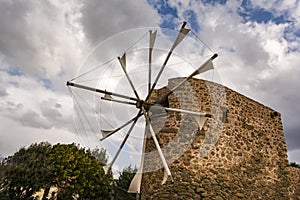 Old stone windmill near Toplou monastery in Crete, Greece