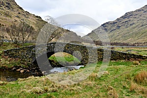 Old stonebridge in the landscape of Scotland highlands