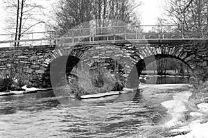 Old stonebridge over the cold water in sweden