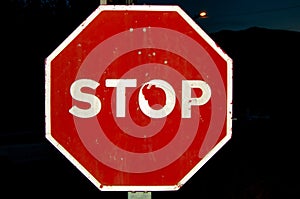 Old stop traffic sign of the road photo