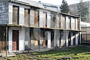 Old storage lockers with wooden doors in a run down part of eastern european city