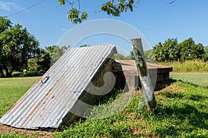 An Old Storm Cellar or Tornado Shelter in Rural Oklahoma.