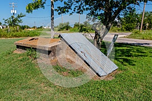 An Old Storm Cellar or Tornado Shelter in Rural Oklahoma. photo