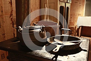 Old stove with pots and pans