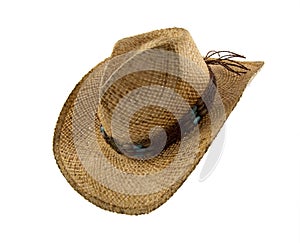 Old straw cowboy hat isolated on white