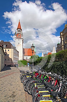 Old street with bicycle parking in the foreground