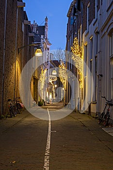 Old street in the city center from Deventer in the Netherlands at sunset