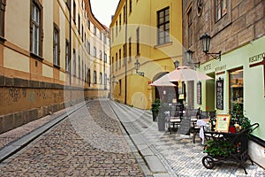 Old street with hotel and restaurant in Prague.