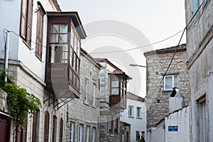 Old street and house in Alacati, Izmir, Turkey photo