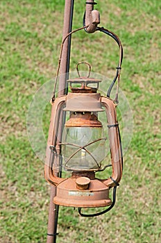 Old street lamp isolated hanging on rust steel