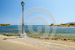 Old street lamp near the road in Aghios Nikolaos