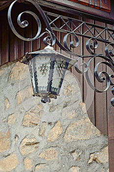 Old street lamp on a wall