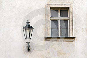 Old street lamp and window in Prague