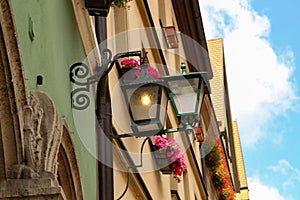 Old street lamps illuminate the way for passersby