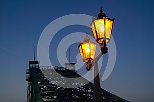 Old street lantern in front of the Loschwitzer bridge over the river Elbe in Dresden