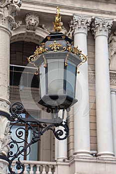 Old street light lantern on bilding photo