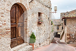 Old street in medieval town San Gimignano, Italy