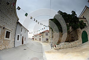 Old street of stone houses, bad weather