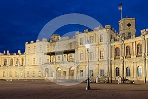 Old streetlight against the background of a main entrance of the Gatchina palace on May night. Gatchina, Russia