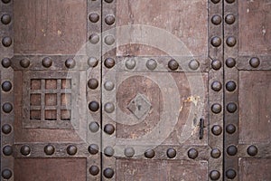 Old strong lock and cast iron latch with speakeasy window photo