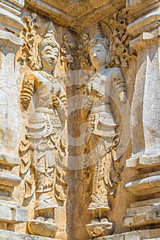 Old stucco Buddha and angel figures on the outside of the Maha Chedi of Wat Chet Yot (Wat Jed Yod) or Wat Photharam Maha Vihara, t