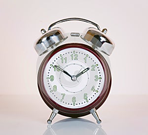 Old style alarm clock isolated.