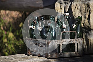 Old style bottles in an iron box