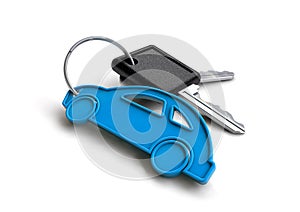 Old style car keys with car icon keyring. Concept for owning a vehicle.