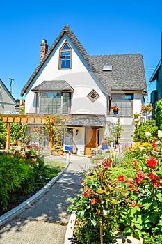 Old style family house with landscaped front yard and pathway to the entrance