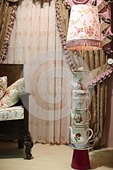 Old-style lamp and window curtains
