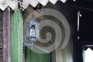 Old style lantern on a wall photo