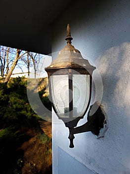 Old style lantern on a wall photo