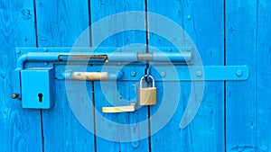 Old style lock and padlock on the blue wooden door - Portoroz  Piran  Obalno-kraska  Slovenia  June 2020