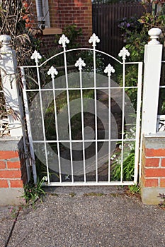 Old style locked gate in white