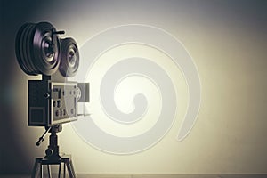 Old style movie camera with white wall, vintage photo effect