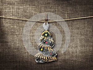 Old style photo and Christmas tree hanging on a clothesline