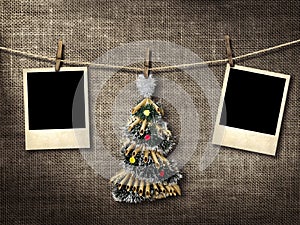 Old style photographs and Christmas tree hanging on a clotheslin