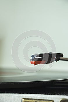 Old style record player of vinyl disc, white background