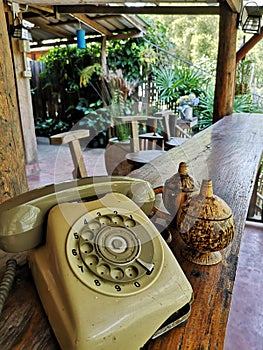 Old style telephone on the wooden table