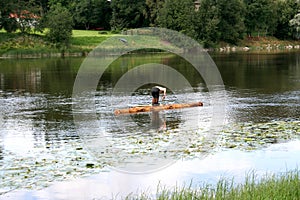 Old style travailing on the river on a log