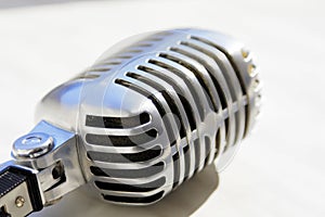 Old style vocal microphone. Retro classic design. Tinted photo