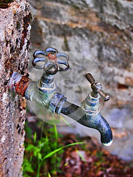 Old Style Water Taps Outside Greek Village House