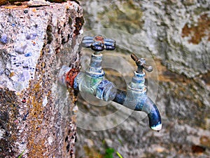 Old Style Water Taps Outside Greek Village House