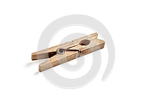 Old style wooden rusty clothespin isolated on white background