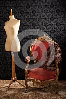 Old styled tailor mannequin and armchair