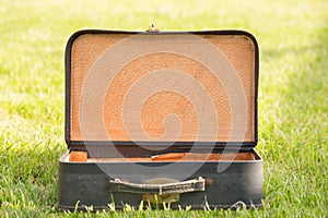 Old suitcase on grass