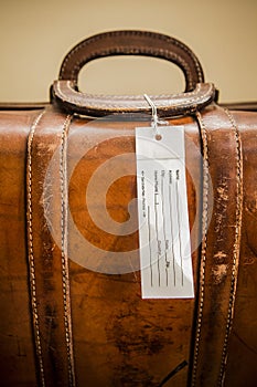 Old Suitcase with Luggage Tag