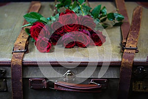 Old suitcase with roses